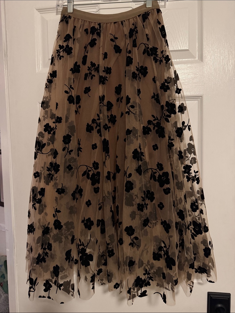 Neutral Mesh Maxi Skirt with Black Floral Appliqué with brown lining.